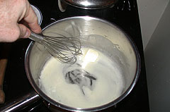 Melting the first pat of butter into the tablespoon of boiling water ...